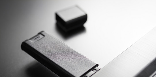 A USB stick is inserted in a laptop.